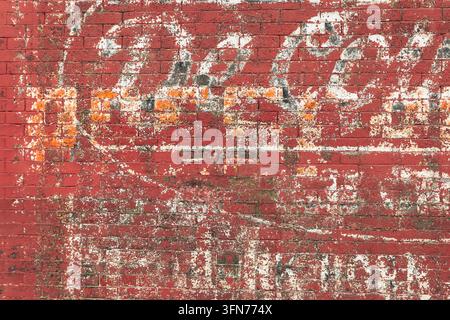 A close-up of a mashup of brand names now lost to history as seen on the side of Midwestern small-town business. Stock Photo