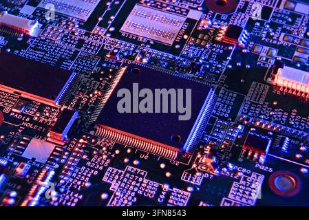 High-detail macro image of a microchip surrounded by glowing neon circuitry, symbolizing futuristic computing, AI technology, cybersecurity, and digit Stock Photo