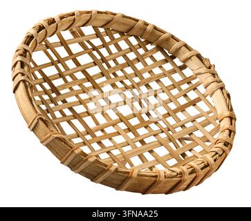 woven bamboo string hopper tray isolated white background, traditional round wooden sieve and handmade kitchen utensil in close-up view Stock Photo