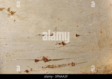 scratched metal surface background, weathered steel texture with brown rust spots and scratches in close-up, industrial grunge design backdrop Stock Photo