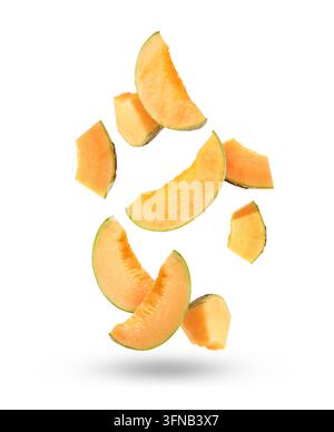 Pieces of cantaloupe melon falling on white background Stock Photo