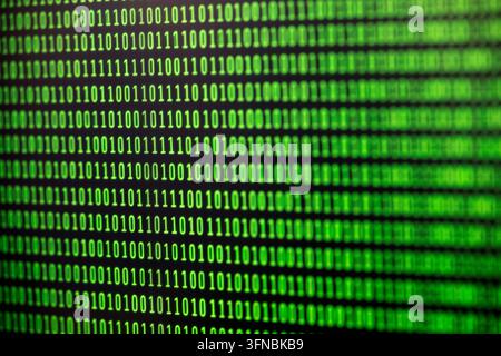 Binary code background on computer screen Stock Photo