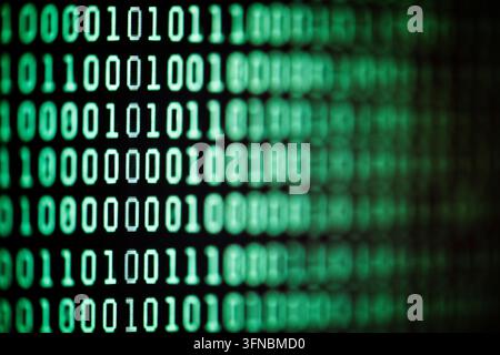 Binary code background on computer screen Stock Photo