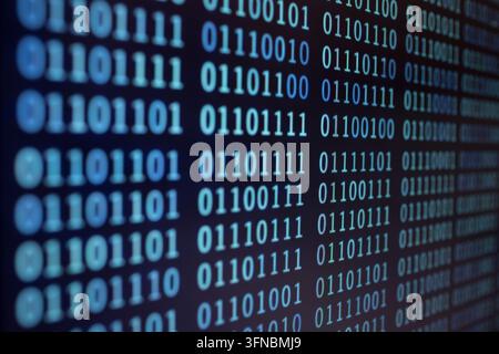 Binary code background on computer screen Stock Photo
