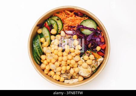 Colorful vegetable bowl with chickpeas, cucumber, carrots and cabbage. Healthy food background for vegetarian lunch, balanced diet and fresh nutrition Stock Photo