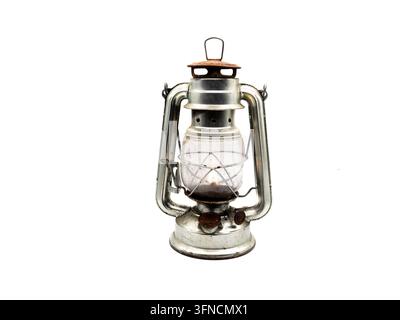 Vintage miner's lamp isolated on a clean white background, representing the history and tradition of mining. The classic industrial object reflects the working life of miners, underground coal extraction, safety equipment, illumination, and industrial heri Stock Photo