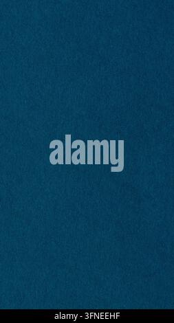 Dark blue paper texture background with fine fibers and grain across a blank matte surface Stock Photo