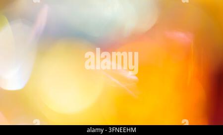 Blurred abstract background with soft orange bokeh and overlapping circular highlights Stock Photo