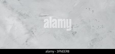 Pale gray concrete surface with uneven trowel strokes and scuffed patches forming a rough background Stock Photo