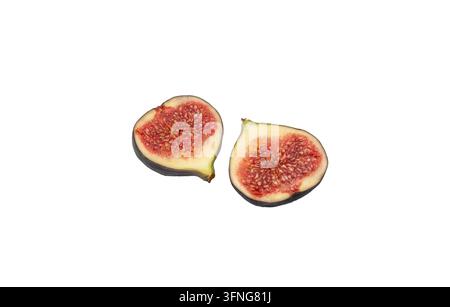 Two fresh fig halves isolated on white background Stock Photo