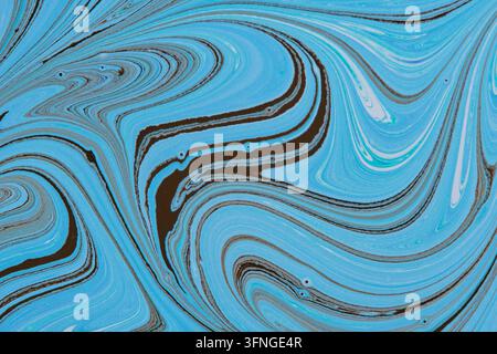 Swirling dark brown and light blue liquid lines forming a smooth marble art background texture pattern Stock Photo