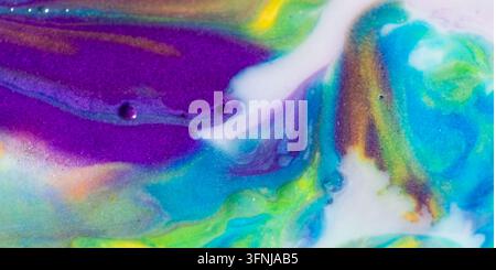 Vibrant abstract background with flowing purple, turquoise, green, and yellow fluid pigments forming organic waves, marbled textures, and luminous col Stock Photo