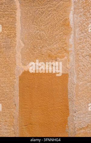 Natural sandstone brick wall with rectangular blocks joined by textured cement mortar. Organic surface with mineral texture Stock Photo
