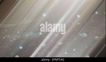 Abstract background featuring soft light streaks and glowing particles. Stock Photo