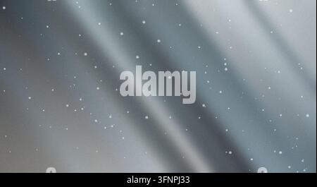 Abstract silver metallic textured background with diagonal shiny waves and white sparkling dust particles scattered across. Stock Photo