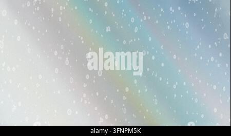 An abstract holographic background featuring soft pastel diagonal gradients of silver, blue, and green with grainy white dots. Stock Photo