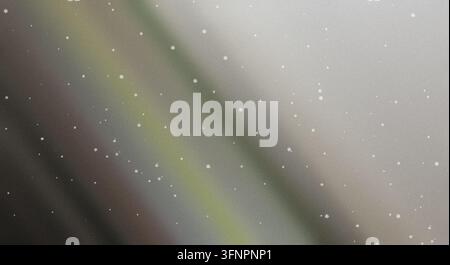 Abstract metallic gradient background featuring soft olive green and silver tones with glowing speckles and waves. Stock Photo