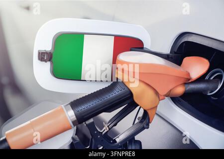 Italy flag on the lid of the gas tank of a car at a gas station in close-up. High or low prices for gasoline and diesel fuel at Italian gas stations. Stock Photo