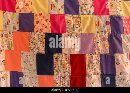 Traditional Handmade Patchwork Quilt with Colorful Fabric Patterns Stock Photo