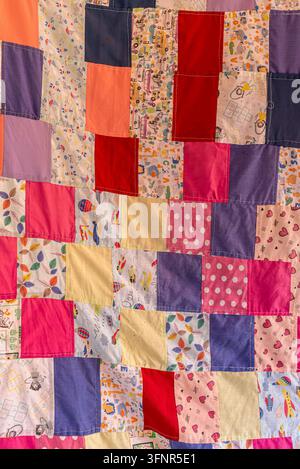 Traditional Handmade Patchwork Quilt with Colorful Fabric Patterns Stock Photo