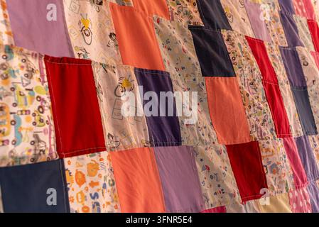 Traditional Handmade Patchwork Quilt with Colorful Fabric Patterns Stock Photo