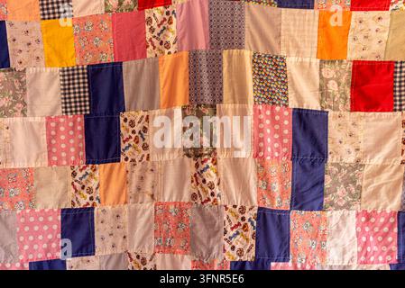 Traditional Handmade Patchwork Quilt with Colorful Fabric Patterns Stock Photo
