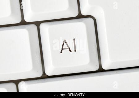 Keyboard key with AI text symbolizing artificial intelligence and digital technology - Photomontage Stock Photo
