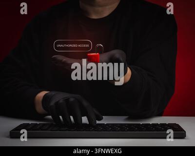 Cybersecurity concept showing unauthorized access with an open warning lock on anonymous hacker hands. System intrusion, compromised access control, a Stock Photo