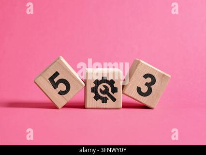 Wooden blocks displaying the 503 HTTP status code for service unavailable and web server maintenance on a pink background Stock Photo