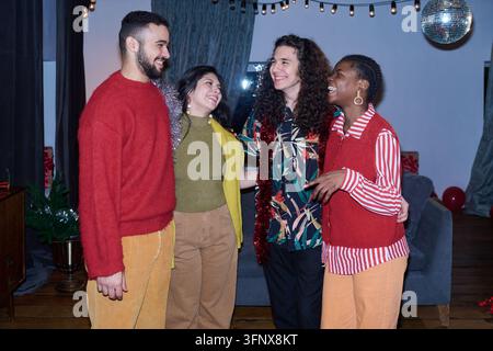 Diverse Group of Friends Celebrating Holiday Party Together Stock Photo
