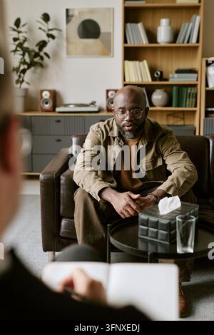 Middle Aged Black Man Having Therapy Session with Psychologist Stock Photo