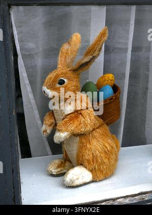 easter bunny figure with easter eggs Stock Photo
