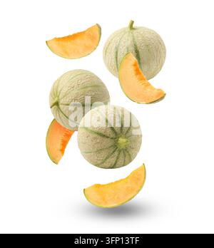 Fresh cantaloupe melons falling on white background. Whole and sliced Stock Photo
