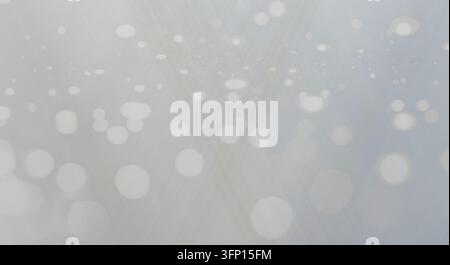 Abstract light bokeh background with soft glowing circles and pale blue tones. Stock Photo