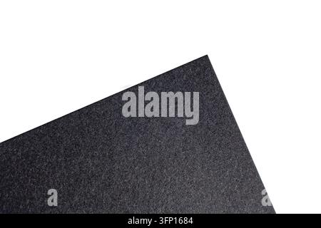 High resolution top view macro photograph detailing textured dark gray synthetic polyester felt cloth sheet corner Stock Photo