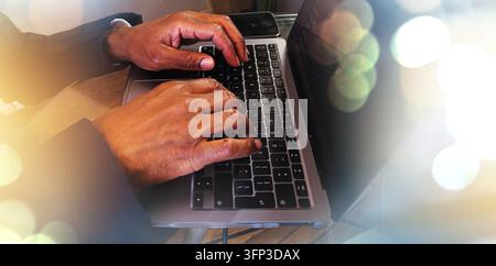 Close up of a professional typing on a laptop working from home. Stock Photo