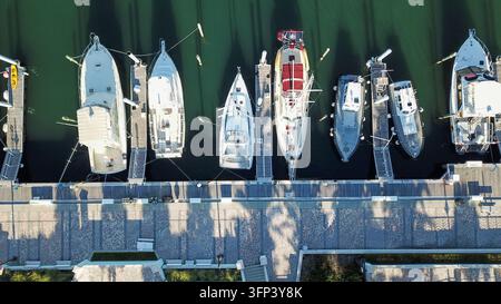 Aerial view of various boats and yachts moored at a marina pier in Palm Beach, Florida, United States. Stock Photo