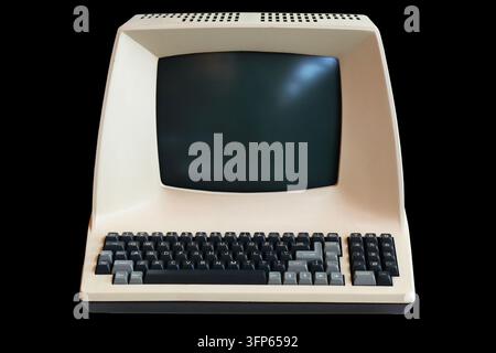 Old personal computer isolated on black background. Vintage PC. Stock Photo