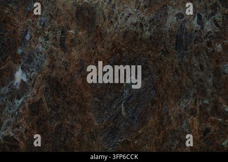 Real stone background. Breccia dark marble natural stone texture background for use on ceramic tiles or as digital background. Stock Photo