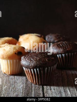 Mini muffins arranged on a wooden background Stock Photo
