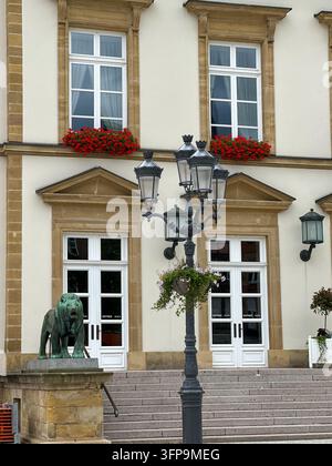 Historic building entrance featuring white double doors, fluted columns ...