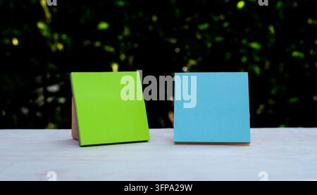 Green and Blue Sticky Notes Outdoor Planning Concept, suitable for planning, organization, reminders, education, and creative communication concepts. Stock Photo