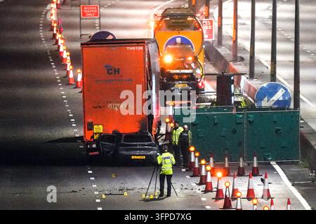 M5 Motorway, Quinton, Birmingham 7th October 2026 - West Midlands Police and Fire Service on scene of a fatal collision on the Northbound M5 Motorway between Junctions 4 and 3 close to the Quinton area of Birmingham on Tuesday (6th) evening. A 39-year-old man, who was driving a silver Peugeot died of fatal injuries at the scene after his vehicle ploughed into the rear of a lorry and caught fire. The car was  pictured on the back of a recovery vehicle with the front completely crumpled. The side of the trailer was also pictured with a large section melted by the fire that ensued after the colli Stock Photo