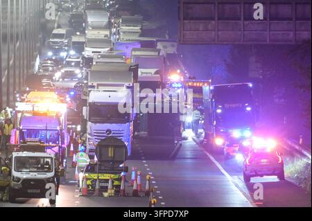 M5 Motorway, Quinton, Birmingham 6th October 2026 - West Midlands Police and Fire Service on scene of a fatal collision on the Northbound M5 Motorway between Junctions 4 and 3 close to the Quinton area of Birmingham on Tuesday (6th) evening. A 39-year-old man, who was driving a silver Peugeot died of fatal injuries at the scene after his vehicle ploughed into the rear of a lorry and caught fire. The car was  pictured on the back of a recovery vehicle with the front completely crumpled. The side of the trailer was also pictured with a large section melted by the fire that ensued after the colli Stock Photo