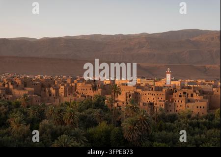 Morocco, a view of Tingherir, the mountains, and the palm oasis at sunset Stock Photo