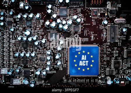 Computer circuit board with the EU flag and the words "AI Act, " photomontage Stock Photo