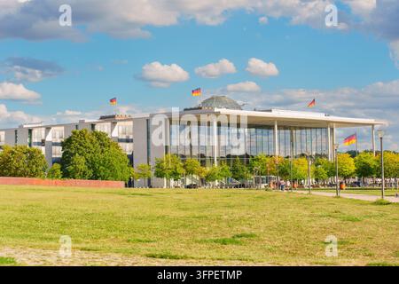 Berlin, Germany - August 29, 2026: Modern glass facade of the Paul-Löbe-Haus government building stands behind a vibrant green lawn in Berlin, Germany Stock Photo