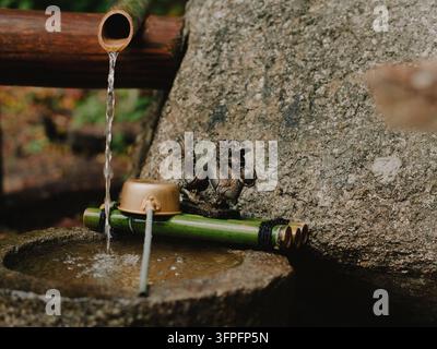 A traditional Japanese bamboo water fountain in a garden in Nagano, Japan. Stock Photo