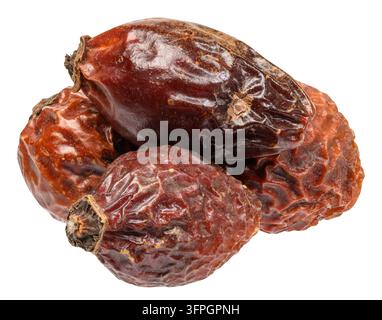 A small pile of dried rose hips with wrinkled skin texture against an isolated background. Stock Photo
