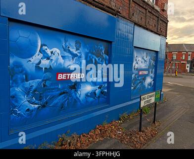 Closed Betfred bookmaker shopfront with covered windows in Padgate Warrington Stock Photo